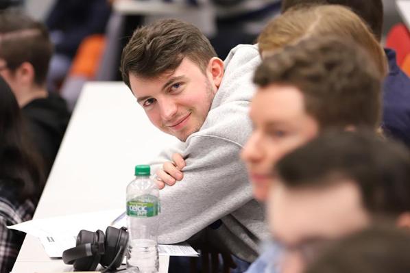 Smiling student in lecture theatre