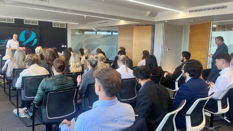 students at a Law firm listening to a presentation