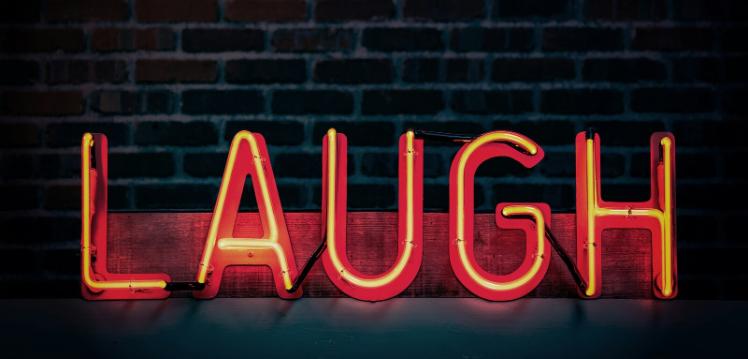 Neon red laugh sign