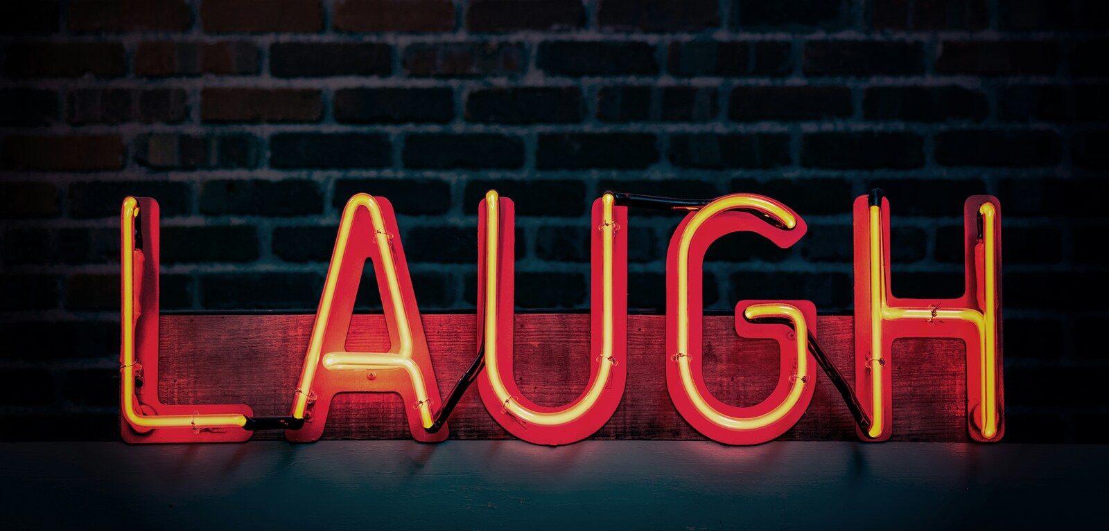 Neon red laugh sign