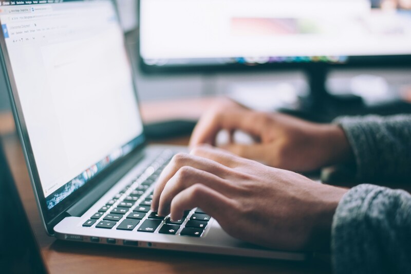 Man doing research on laptop