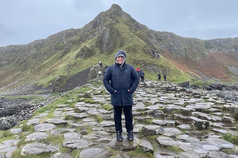 Student Miguel standing on rock formation in Giant's Causeway