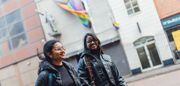 Two female students walking past Kremlin nightclub