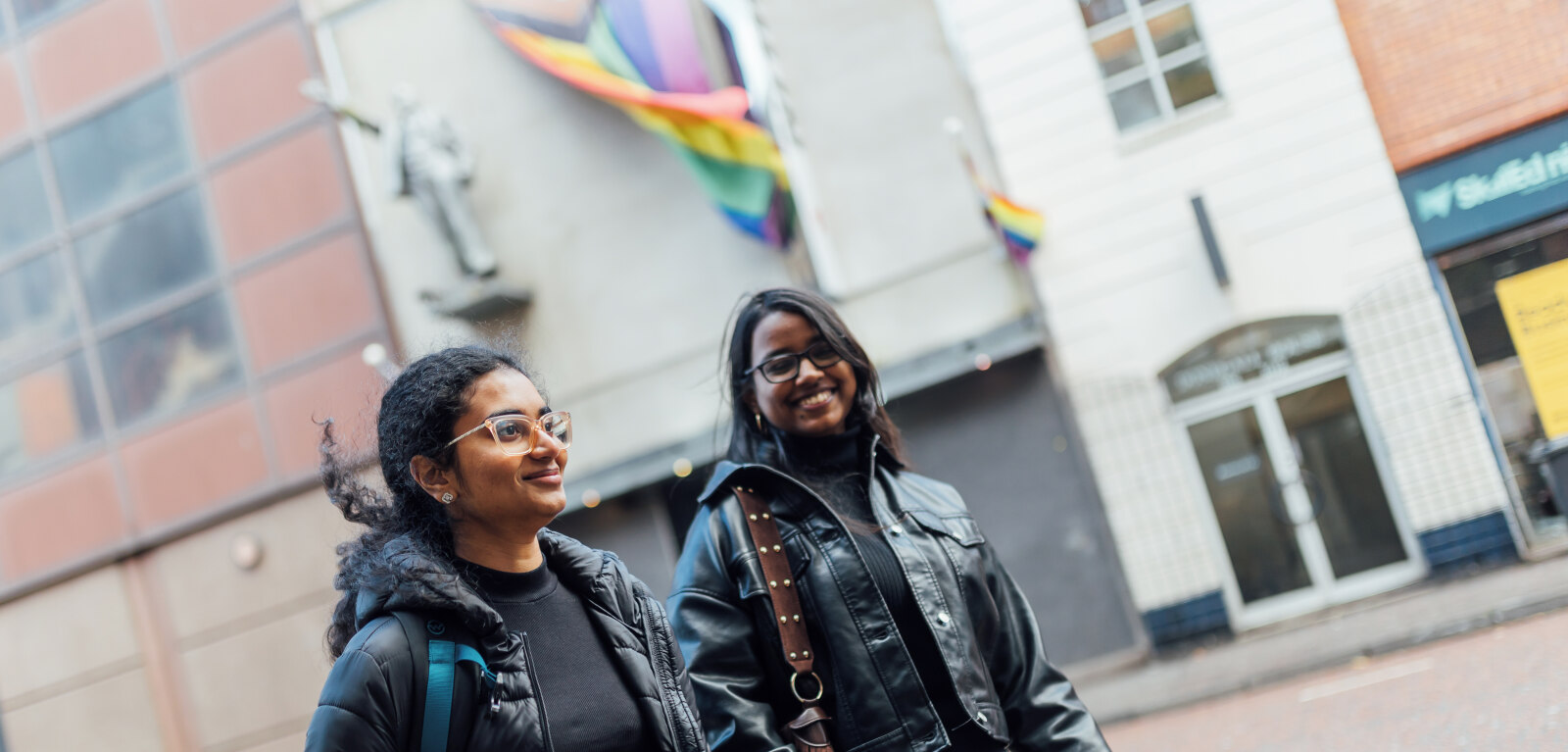 Two female students walking past Kremlin nightclub