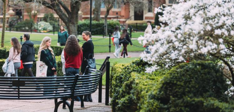 Group of students having a conversation in the Quad