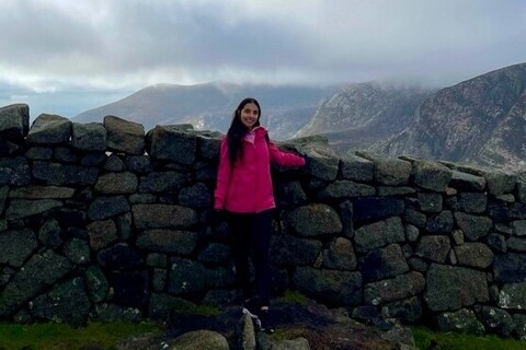 Student in front of Slieve Donard wall