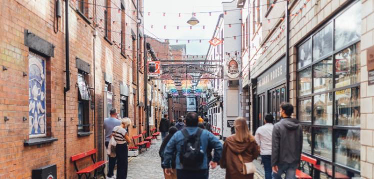 Students walk down Commercial Court in Belfast