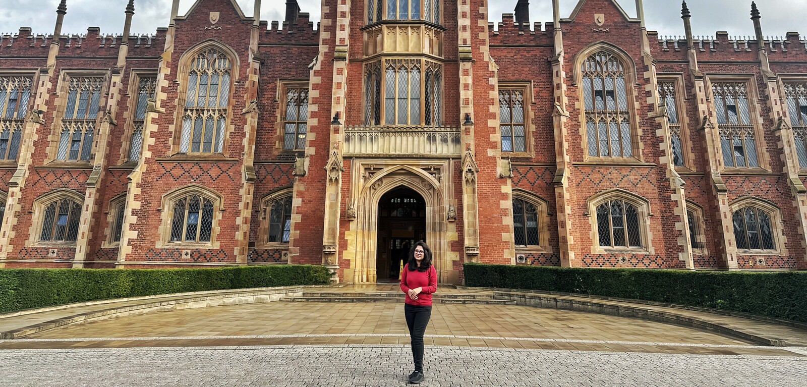 Student Suhrath in front of the Lanyon building