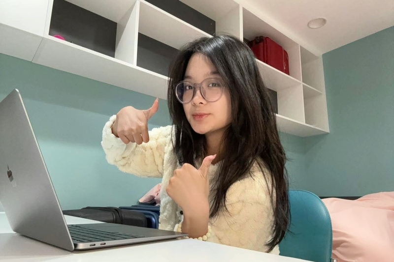 Student Thu at desk in accommodation