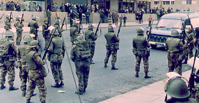 Soldiers standing guard outside Unity Flats