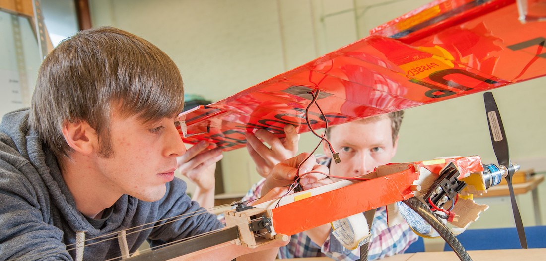 Students building model aircraft