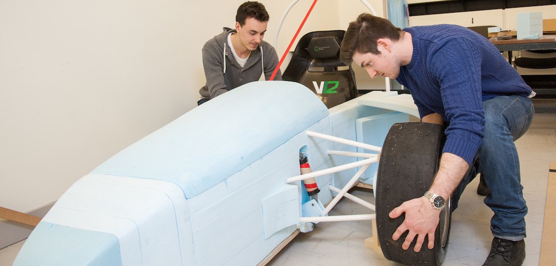 Students with formula car prototype