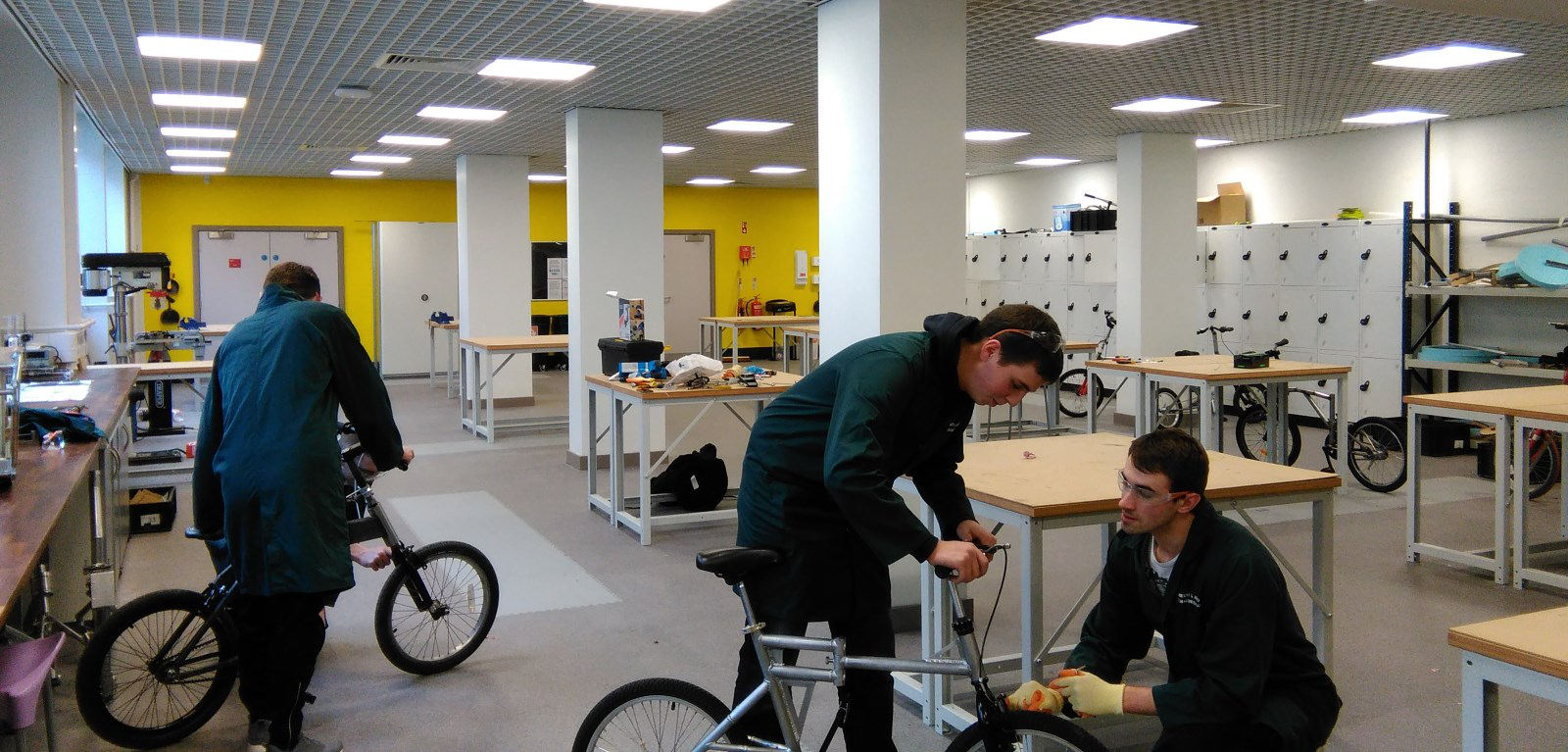 Students building folding bicycles 