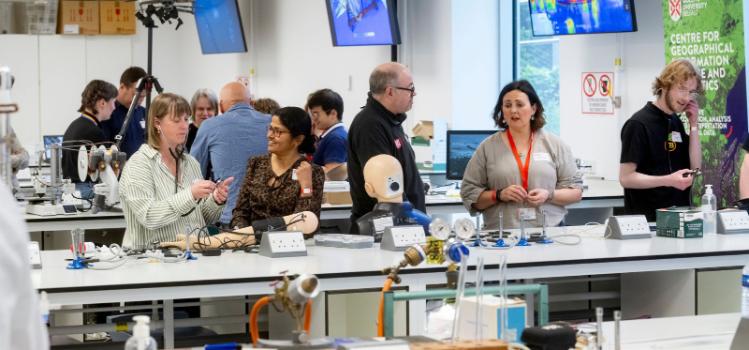 technicians demonstrating and chatting in a lab at the Technician Showcase 2024
